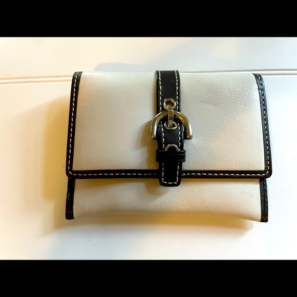Coach white leather small wallet with brown leather buckle belt.